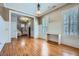 Bright living room with hardwood floors, wainscoting, large windows, and ample natural light at 489 Carter Se Ave, Atlanta, GA 30317