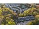 Aerial view of the complex surrounded by trees and parking at 1941 Brian Way # 1941, Decatur, GA 30033