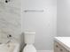 A clean bathroom features a standard toilet and tub with a white marble shower wall at 1941 Brian Way # 1941, Decatur, GA 30033