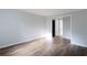 Bedroom with modern hard surface floors, neutral paint, and entry to the bathroom and closets at 1941 Brian Way # 1941, Decatur, GA 30033