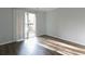Bedroom with modern hard surface floors, neutral paint, and sliding glass doors to the balcony at 1941 Brian Way # 1941, Decatur, GA 30033