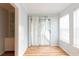 Bright dining area with hardwood floors and sliding glass doors to the outdoor deck, bathed in natural light at 1941 Brian Way # 1941, Decatur, GA 30033