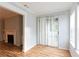 Dining area with hardwood floors, sliding glass doors to the outside, and entry to the living room with fireplace at 1941 Brian Way # 1941, Decatur, GA 30033