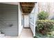 Inviting front entrance with a well-lit walkway, manicured bushes, and a charming door at 1941 Brian Way # 1941, Decatur, GA 30033