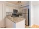 Kitchen featuring stainless steel appliances, granite countertops, and white cabinets with plenty of storage at 1941 Brian Way # 1941, Decatur, GA 30033