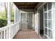 Outdoor patio with glass sliding door and a white wooden railing at 1941 Brian Way # 1941, Decatur, GA 30033