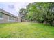 Spacious backyard with lawn and mature trees at 228 Roberts Trl, Locust Grove, GA 30248
