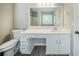 Bathroom vanity featuring white cabinetry, drawers, and a granite countertop at 228 Roberts Trl, Locust Grove, GA 30248