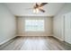 Large primary bedroom with vaulted ceilings, a ceiling fan, and natural light at 228 Roberts Trl, Locust Grove, GA 30248