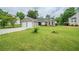 Charming single-story home featuring a two-car garage, manicured lawn, and cozy stone accents at 228 Roberts Trl, Locust Grove, GA 30248