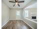 Open living room with door to back yard and brick fireplace at 228 Roberts Trl, Locust Grove, GA 30248