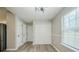A bright room features wood-look floors and a window at 228 Roberts Trl, Locust Grove, GA 30248