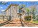 Exterior shot of a house showcasing a wooden deck and spacious backyard at 752 Alison Jane Ne Ct, Kennesaw, GA 30144