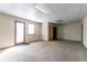 Spacious basement featuring carpet flooring and a bright walk-out door at 752 Alison Jane Ne Ct, Kennesaw, GA 30144