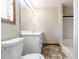 Bright bathroom featuring a shower and a modern white vanity for storage at 752 Alison Jane Ne Ct, Kennesaw, GA 30144