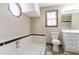Clean, well-lit bathroom with a combined tub and shower and ample storage space at 752 Alison Jane Ne Ct, Kennesaw, GA 30144