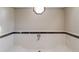 Neutral bathroom with a decorative window above the bathtub at 752 Alison Jane Ne Ct, Kennesaw, GA 30144