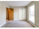 Cozy bedroom with a large window for natural light at 752 Alison Jane Ne Ct, Kennesaw, GA 30144