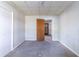 Bedroom with gray carpet, and an open wood door leading to another room at 752 Alison Jane Ne Ct, Kennesaw, GA 30144