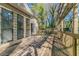 Wooden deck connected to the house with access through a door and large windows, ideal for outdoor relaxation and entertainment at 752 Alison Jane Ne Ct, Kennesaw, GA 30144