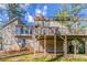 Back view of the home showing a large wooden deck with a wooden canopy over the top at 752 Alison Jane Ne Ct, Kennesaw, GA 30144