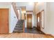 The foyer features hardwood floors, a carpeted staircase, and a stained wood front door at 752 Alison Jane Ne Ct, Kennesaw, GA 30144