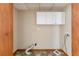 Utility room with white cabinets, connection points and vinyl flooring at 752 Alison Jane Ne Ct, Kennesaw, GA 30144