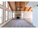 Spacious living room features a stone fireplace and a wood-beamed vaulted ceiling at 752 Alison Jane Ne Ct, Kennesaw, GA 30144
