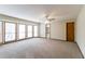 Relax in this living room with large windows and neutral carpet at 752 Alison Jane Ne Ct, Kennesaw, GA 30144