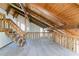 Lofted area featuring exposed wood beams and a unique architectural design at 752 Alison Jane Ne Ct, Kennesaw, GA 30144