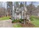 Charming two-story home with a well-maintained lawn and an inviting facade at 76 Riverbend Trl, Douglasville, GA 30134