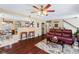 Inviting living room featuring hardwood floors, a ceiling fan, and an open floor plan at 76 Riverbend Trl, Douglasville, GA 30134