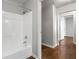Bathroom featuring a white tub/shower at 900 Oakhill Sw Ave, Atlanta, GA 30310