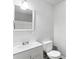 Bathroom featuring a white vanity and commode at 900 Oakhill Sw Ave, Atlanta, GA 30310
