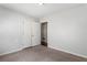 Bedroom featuring neutral carpet, light gray walls, and closet at 900 Oakhill Sw Ave, Atlanta, GA 30310