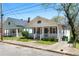 Charming craftsman-style home with inviting front porch and well-maintained landscaping at 900 Oakhill Sw Ave, Atlanta, GA 30310
