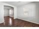 Spacious living room with dark hardwood floors and neutral paint at 900 Oakhill Sw Ave, Atlanta, GA 30310