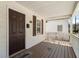 Covered front porch with welcome mat, and view of front door at 900 Oakhill Sw Ave, Atlanta, GA 30310