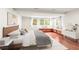 Stylish bedroom features hardwood floors and sun-lit window seating at 106 Maple St, Roswell, GA 30075