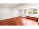 Bonus room features hardwood floors, neutral walls, lots of natural light and built-in bench seating at 106 Maple St, Roswell, GA 30075
