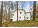 A beautiful shot of the side and rear of the white exterior at 106 Maple St, Roswell, GA 30075