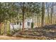 Charming exterior view of a two-story home with landscaped front yard at 106 Maple St, Roswell, GA 30075