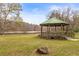 Scenic gazebo with green roof overlooking a beautiful lake at 106 Maple St, Roswell, GA 30075