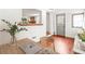 Well-lit home office with a wooden desk, workspace, and a view to the living room for seamless connectivity at 106 Maple St, Roswell, GA 30075