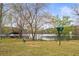 Playground with swings and equipment, set against the backdrop of a serene lake at 106 Maple St, Roswell, GA 30075