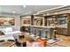 Finished basement boasts a custom bar with seating, custom cabinets, and living area at 237 Webney Se Dr, Marietta, GA 30068