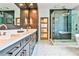 Modern bathroom with marble floors, a double vanity, a sleek glass shower, and contemporary lighting fixtures at 237 Webney Se Dr, Marietta, GA 30068