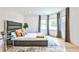 Bedroom featuring a modern platform bed, a large window, light wood floors, and a gray shag rug at 237 Webney Se Dr, Marietta, GA 30068