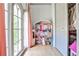 Bright bedroom with large window, toy dollhouse and closet with clothes at 237 Webney Se Dr, Marietta, GA 30068