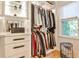 Bright, well-organized closet featuring built-in shelving, drawers, and hanging space illuminated by natural light at 237 Webney Se Dr, Marietta, GA 30068